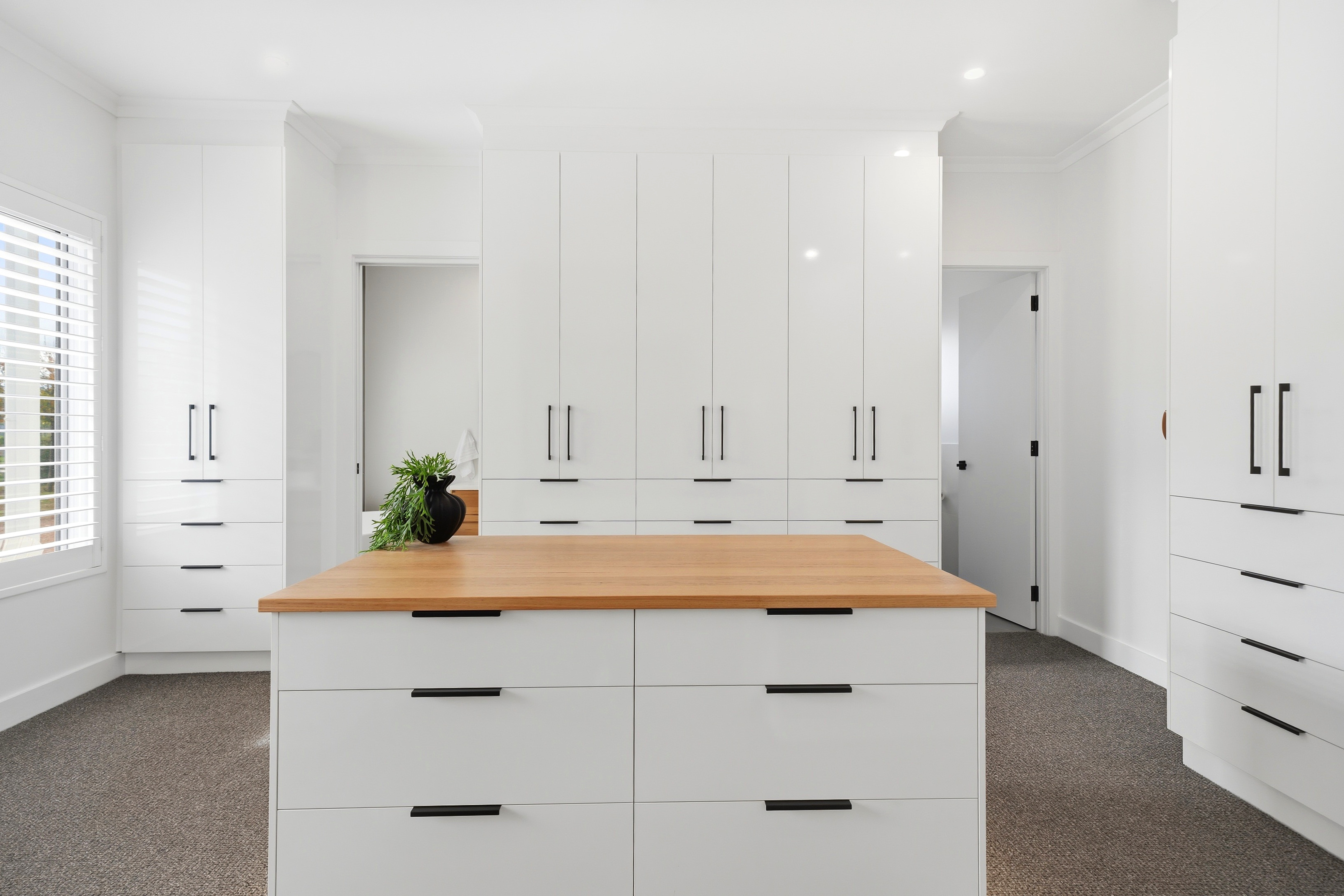 Walk-in robe with custom joinery