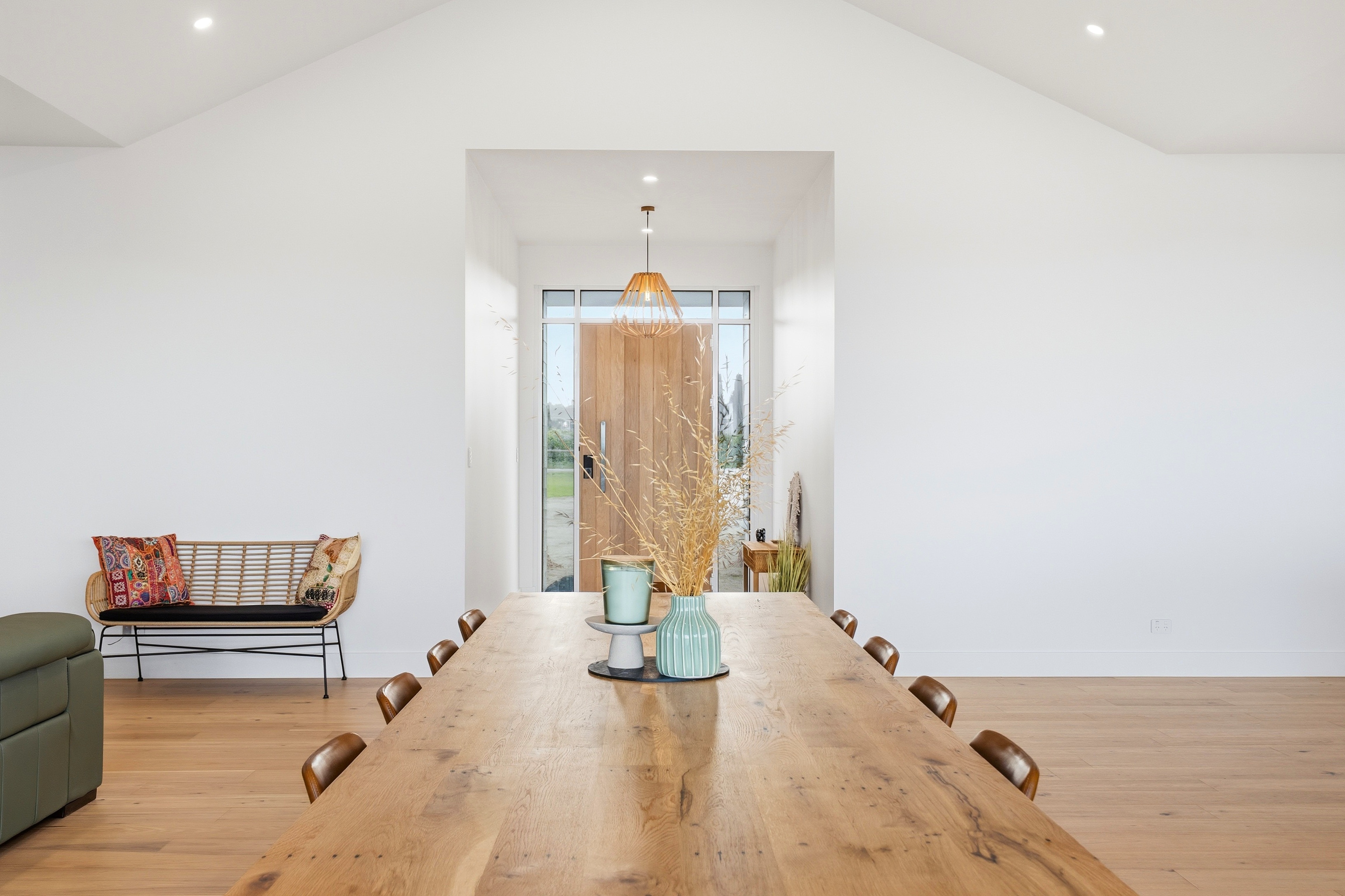 Dining table looking through to the timber entry