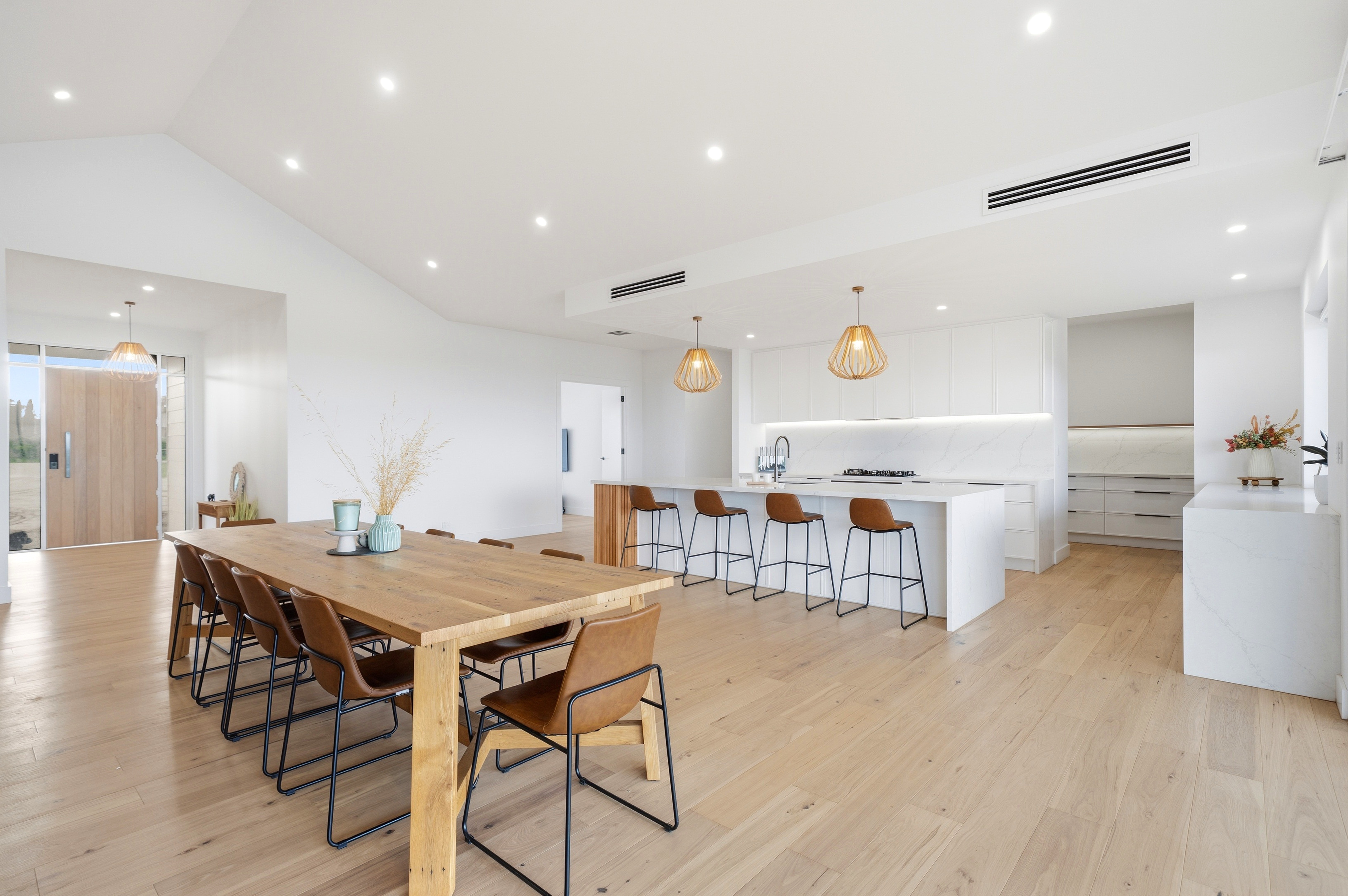 Dining and kitchen with entry beyond